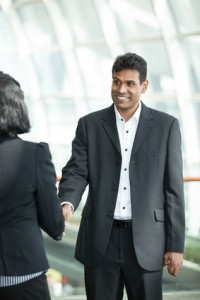 Asian business man shaking hands with a woman