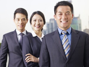 asian business team, focus on man in front